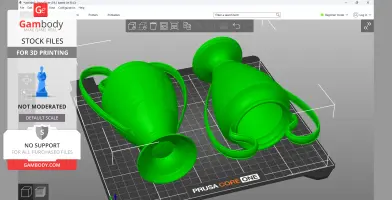 Two green 3D models of iconic football trophies, one engraved, on a digital print bed.