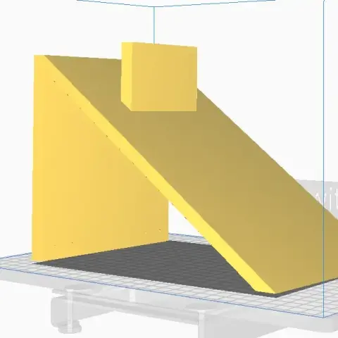 Yellow, angled helmet stand on a 3D printing platform.