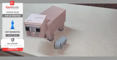 Blocky Minecraft sheep candy holder with a small gray sheep figure beside it on a table.