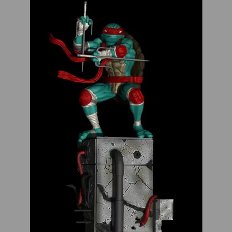 A ninja turtle action figure poised with weapons on a cracked urban-themed base.
