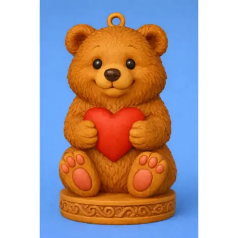 Cute bear holding a red heart, sitting on a decorative base with a loop on top for hanging.