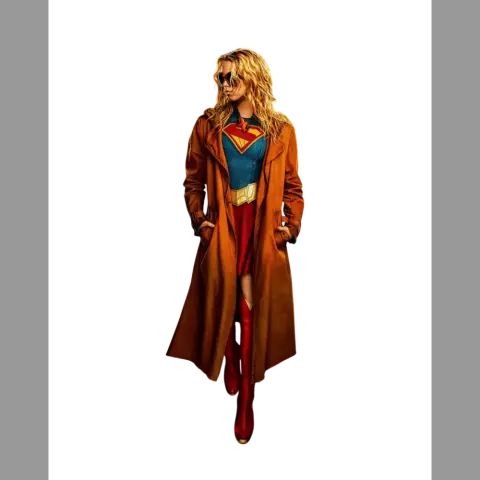 Blonde superhero in a red and blue outfit with a long brown coat and red boots.