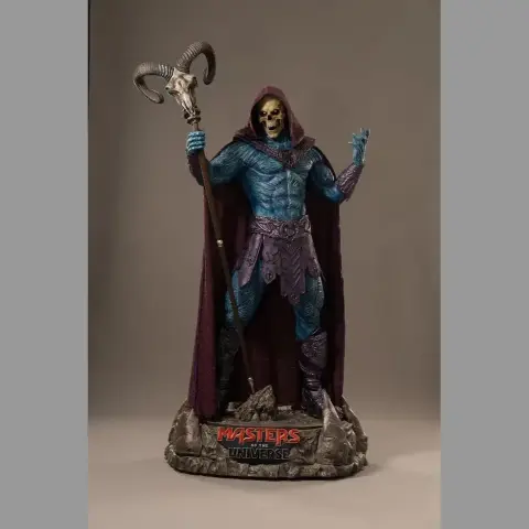 A cloaked skeleton warrior with ram staff, standing on a base with skulls and flames, in a menacing pose.