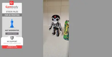 Day of the Dead skeleton puppet figurine with black and white design, next to a colorful can.