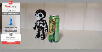 Day of the Dead skeleton puppet model beside colorful energy drink can.
