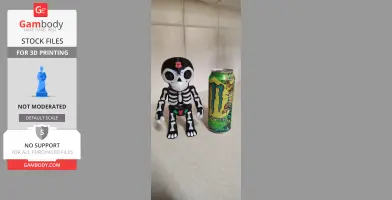 Skeleton-themed puppet model beside a colorful energy drink can.