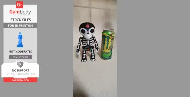 A Day of the Dead themed skeleton toy beside a vibrant energy drink can on a countertop.