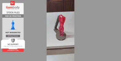 A red 3D-printed figure of a space-themed character with arms raised, standing on a round base.