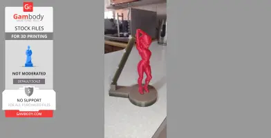 A 3D printed red figurine of a spacegirl on a circular base, with a slanted support structure behind.