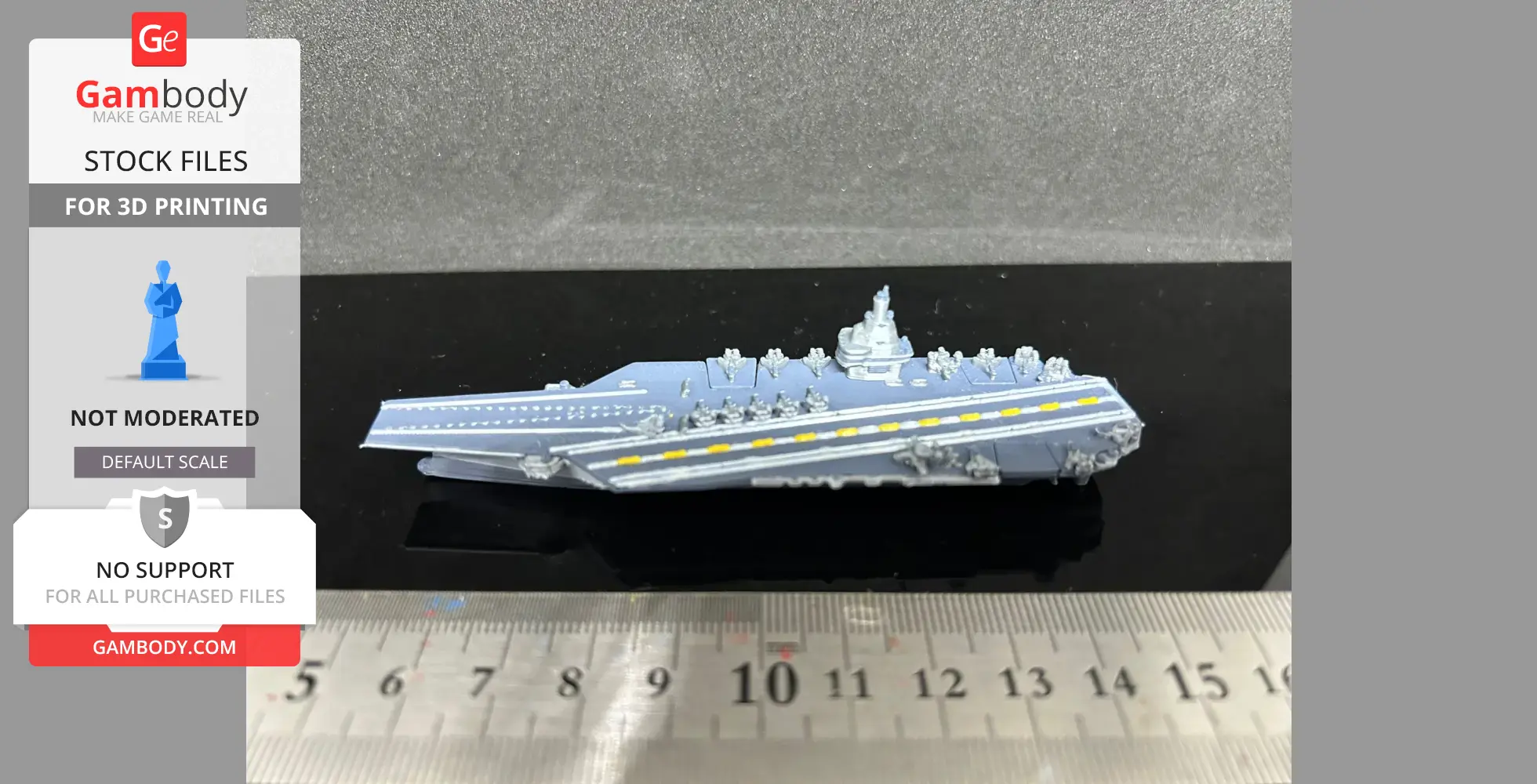 Miniature Chinese aircraft carrier model with detailed deck and conning tower, next to a ruler.