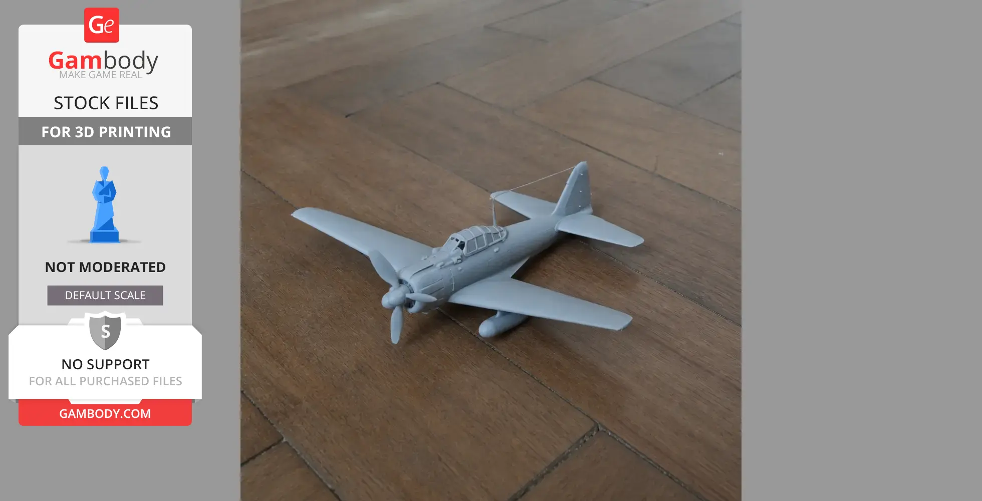 Gray 3D printed model of an A6M Zero plane on a wooden surface.