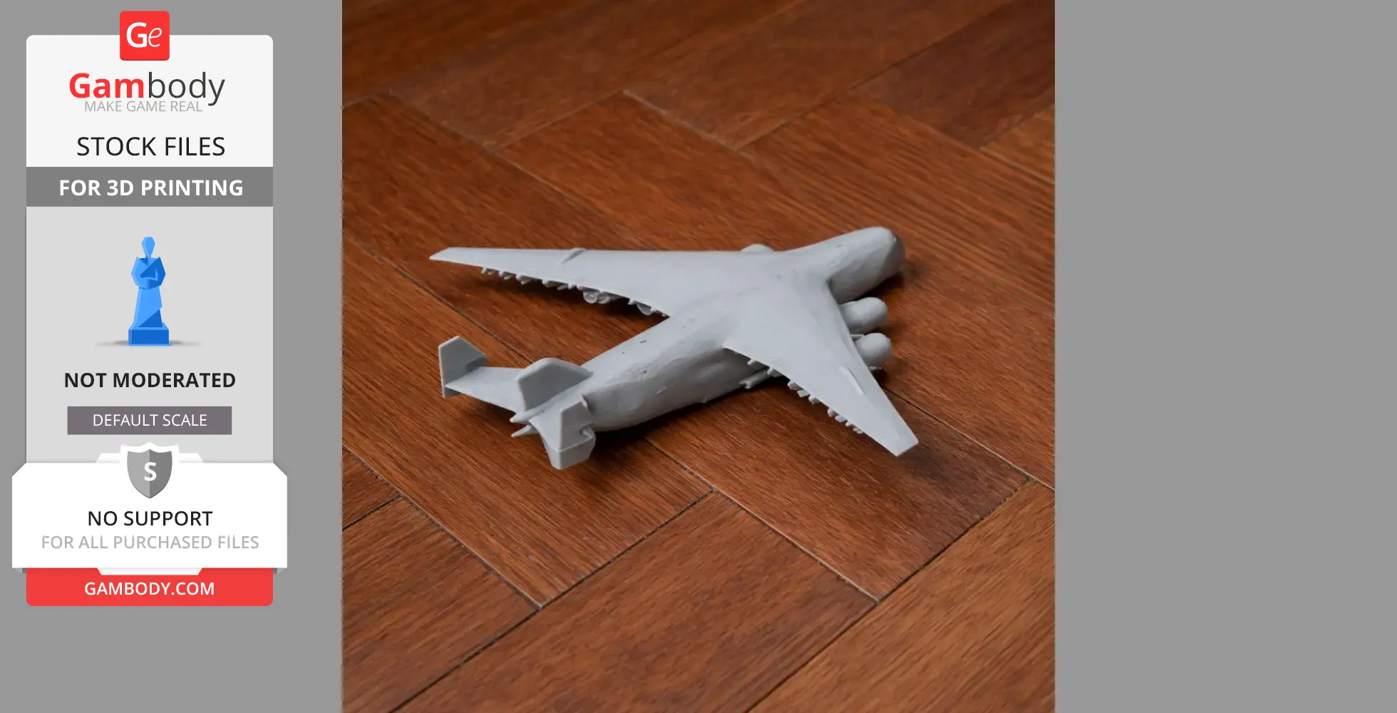 Gray 3D-printed model of Antonov An-225 plane on a wooden surface.