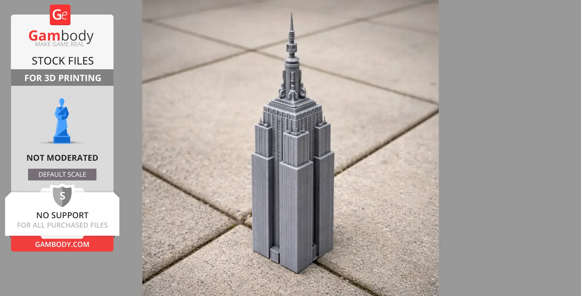 A 3D-printed model of the Empire State Building on a tiled surface.