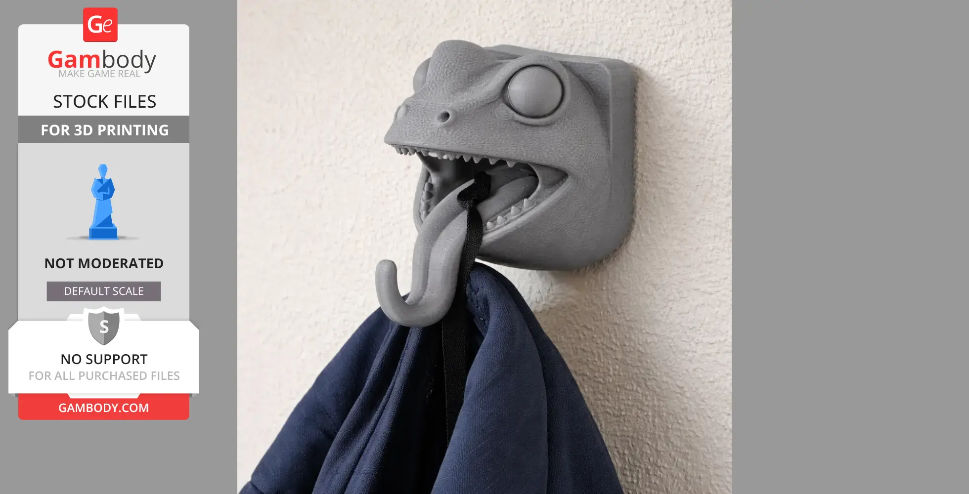 A wall-mounted frog head hook holding a coat with an open mouth and protruding tongue.
