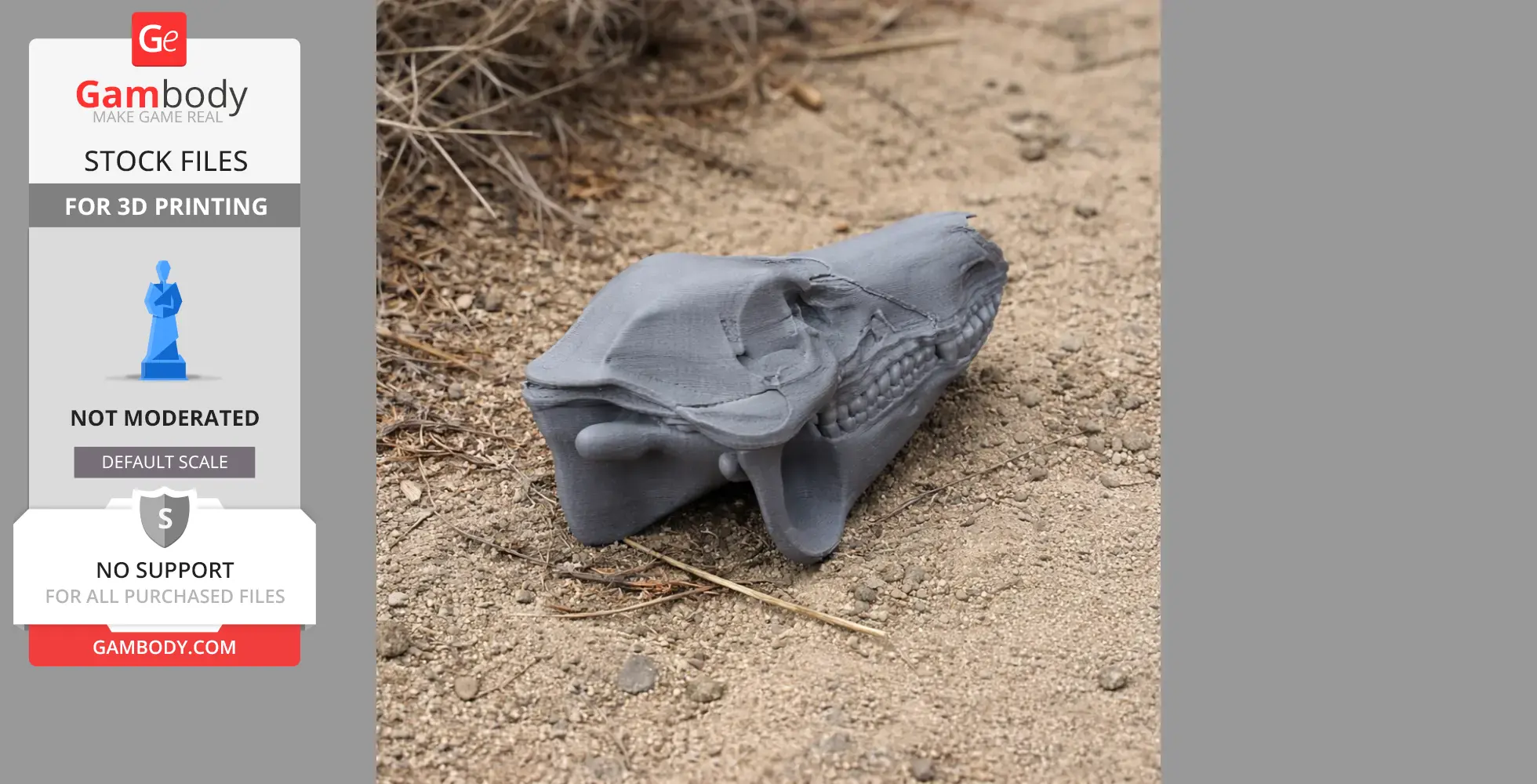 A 3D-printed boar skull model in gray, resting on sandy ground with dry grass nearby.