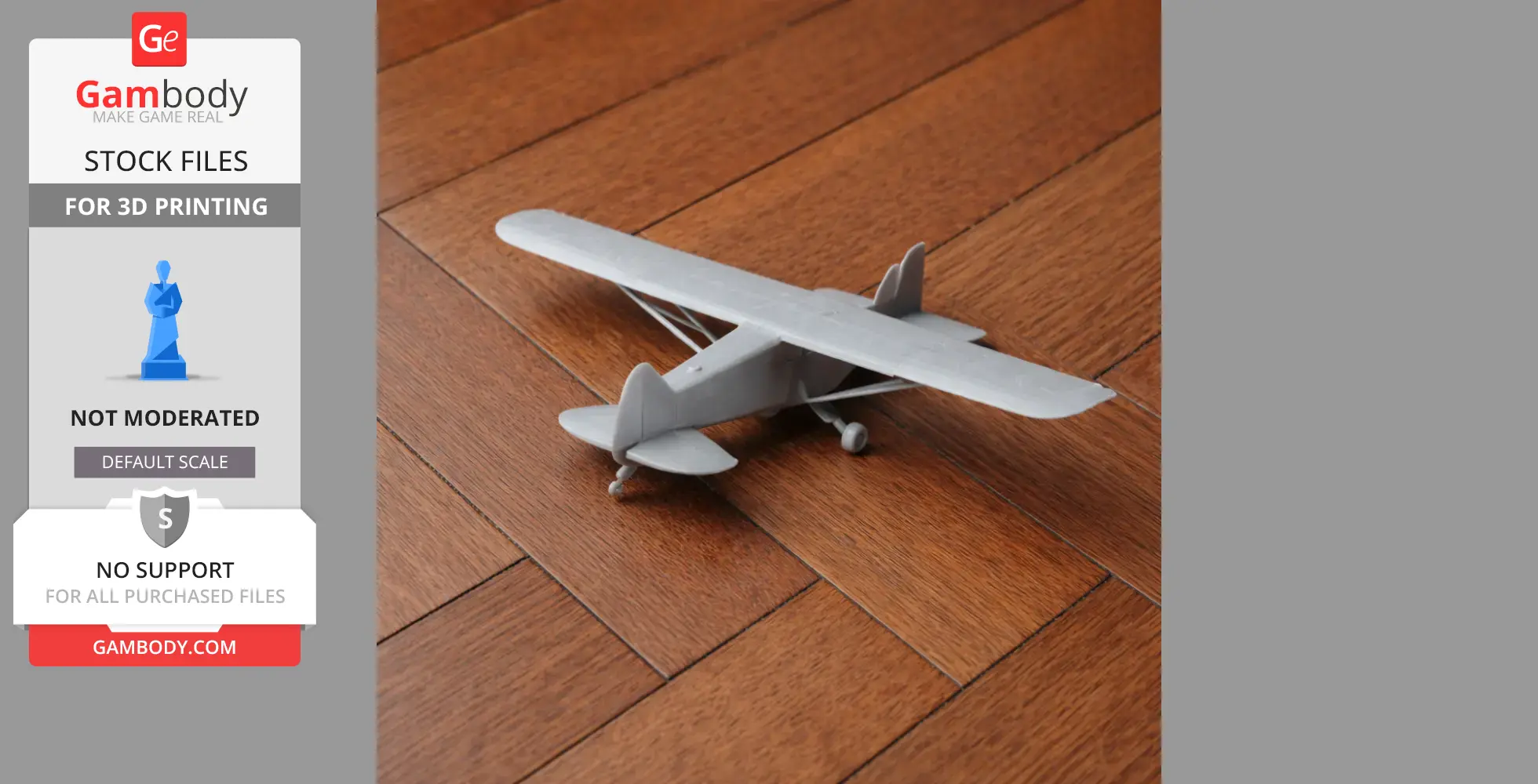 A 3D-printed Piper Cub plane model on a wood surface.