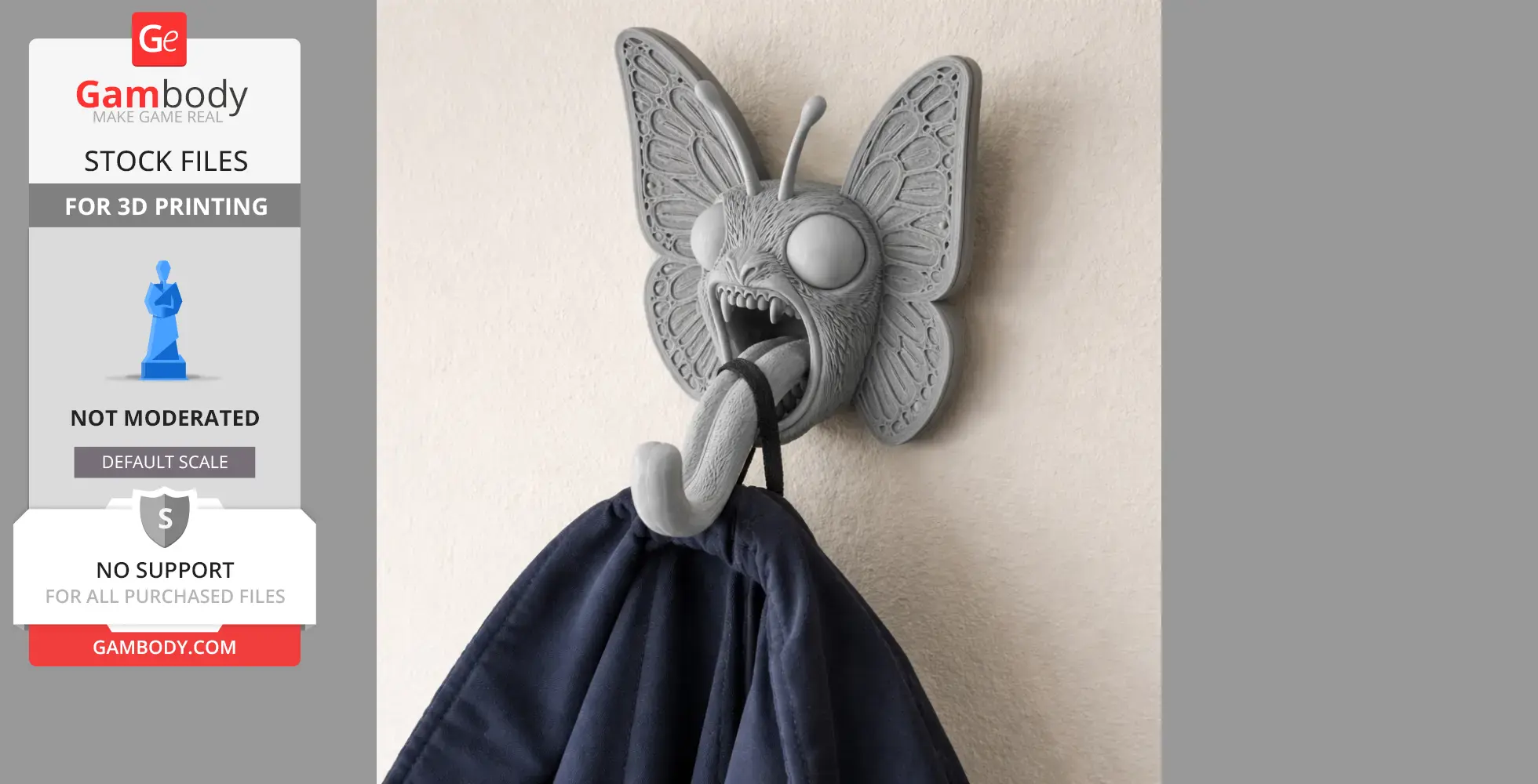 3D-printed stylized butterfly wall hook with large eyes holding a dark cloth.