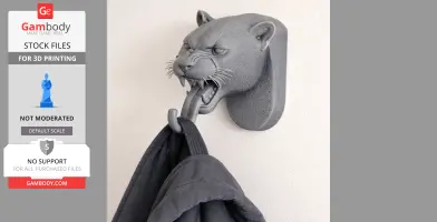 3D-printed leopard head wall hanger holding a coat on its hook-like tongue.
