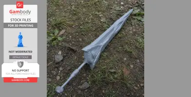 A detailed gray 3D printed sword with intricate designs, lying on the grass and gravel.