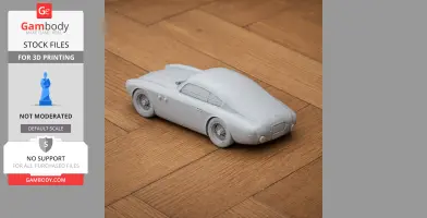 Gray 3D printed model of Abarth 205A Berlinetta on a wooden surface.