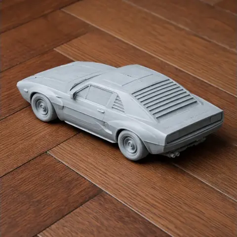 Scale model of a vintage sports car on a wooden floor, designed for 3D printing.