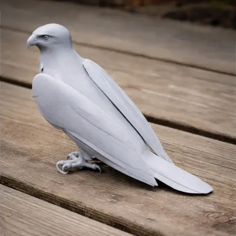 3D-printed model of a perched, detailed bird on a wooden surface.