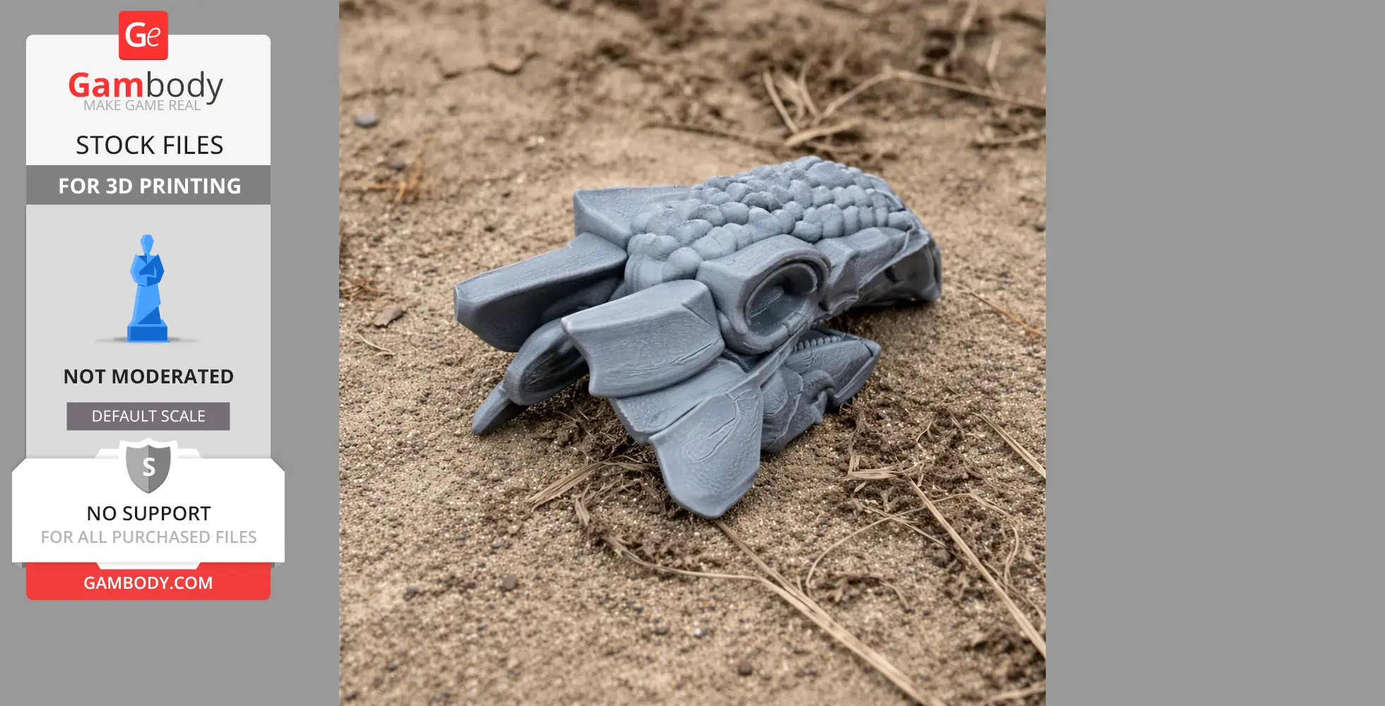 Gray 3D-printed Ankylosaurus skull model resting on a sandy ground.