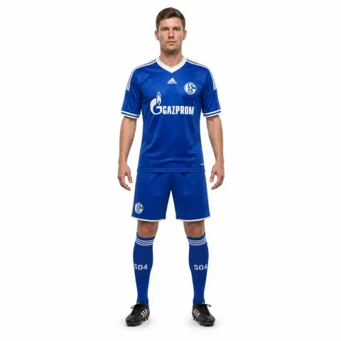 A 3D model of a male soccer player in a blue jersey and shorts, standing upright with arms relaxed at sides.