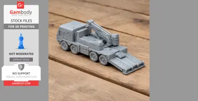 3D-printed model of a military tank with multiple wheels and a rectangular turret on a wooden surface.