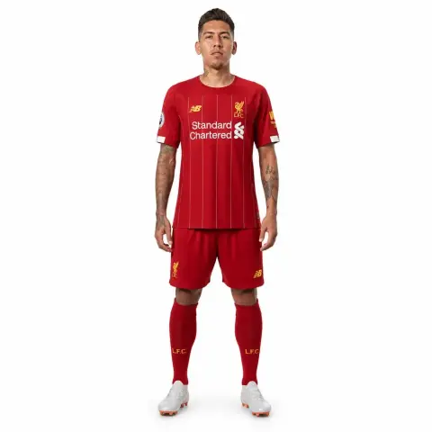 A 3D model of a soccer player in a red kit, standing with arms by sides.