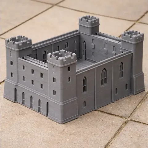 Gray 3D-printed model of a fortified castle with four corner towers and detailed windows.