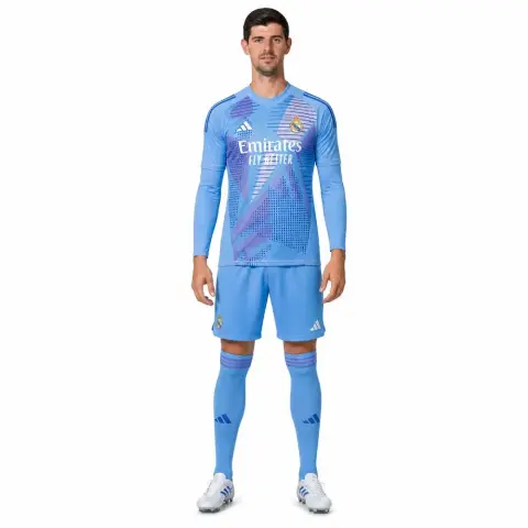 I don't know who this is, but it shows a person in a blue soccer uniform and white cleats, standing upright.