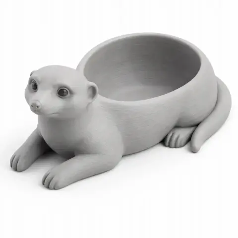3D meerkat-shaped bowl with lifelike features and a hollow body for holding items.