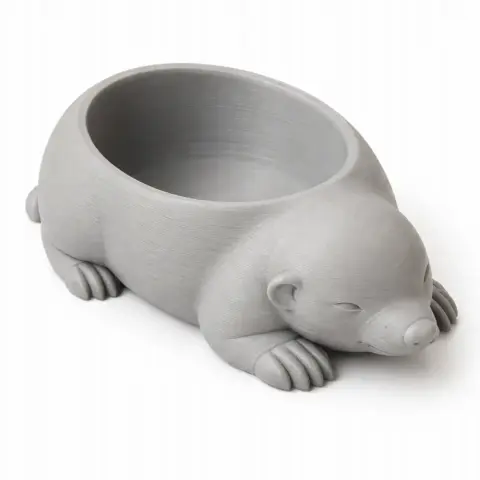 3D-printed mole-shaped bowl with a smooth finish, used as a wall hook or container.