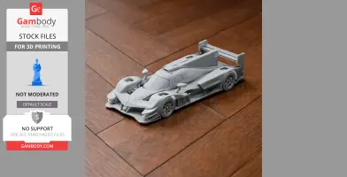 A 3D printed model of an Acura ARX-05 race car on a wooden floor.
