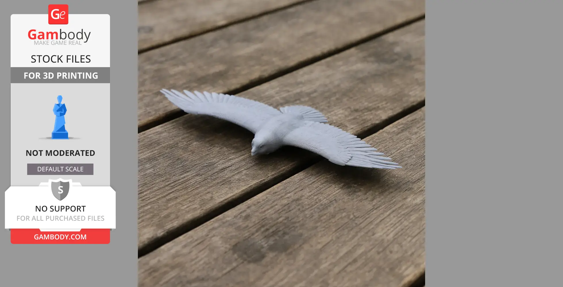 Gray 3D-printed model of a soaring bird with wings spread, displayed on a wooden surface.