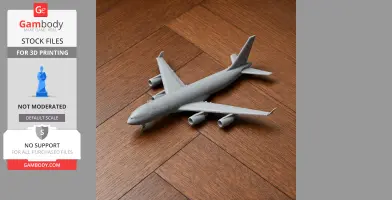 3D printed model of an Airbus A340 aircraft on a wooden surface.