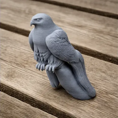 A detailed 3D-printed model of a gyrfalcon, standing on wooden planks.