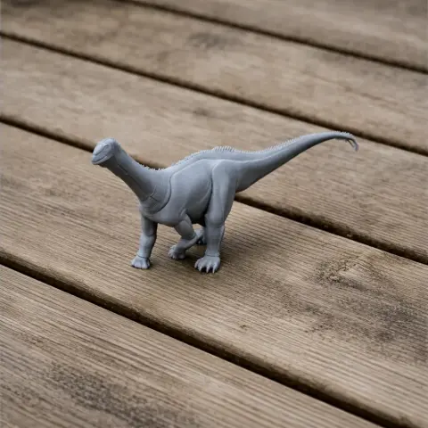 Gray 3D-printed model of a Haplocanthosaurus dinosaur on wooden planks.