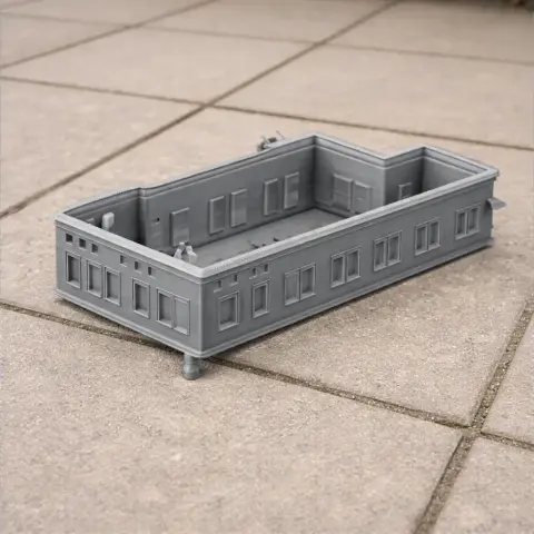 3D printed model of Al-Gawhara Palace's rectangular architectural structure in gray.