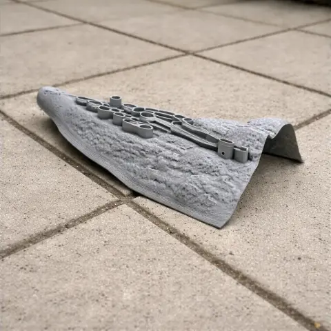 3D-printed model of Alamut Castle's architecture, detailed, on a tiled surface.