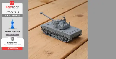 Gray 3D-printed tank model with turret and cannon, displayed on a wooden surface.