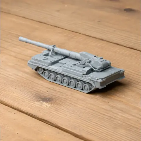 A detailed 3D-printed model of a 2S7 Pion tank on a wooden surface.