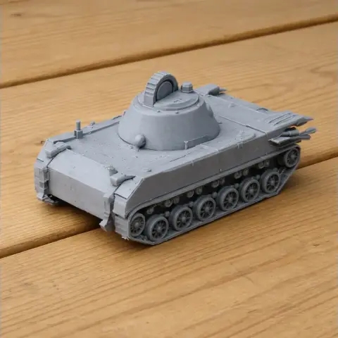Gray 3D-printed model of a 2S9 Nona tank on a wooden surface.