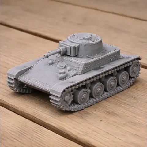 Gray 3D-printed tank model with six wheels on each side and turret detail on a wooden surface.