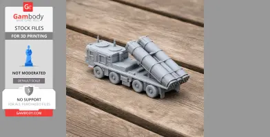 3D printed model of a military vehicle with missile launchers, displayed on a wooden surface.