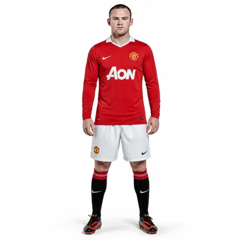 A soccer player figurine in a red jersey and white shorts, standing with hands by sides.