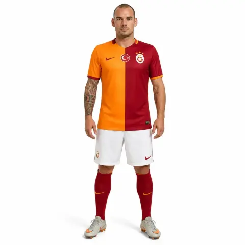 A soccer player figurine wearing a split orange-red uniform with white shorts and red socks.
