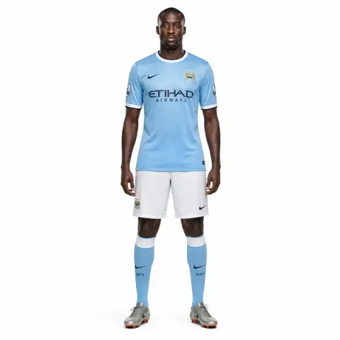 A 3D printed figurine of a soccer player in a light blue jersey and white shorts, standing upright.
