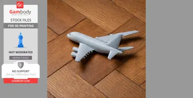 3D printed gray model of an Airbus A380 on a wooden floor.